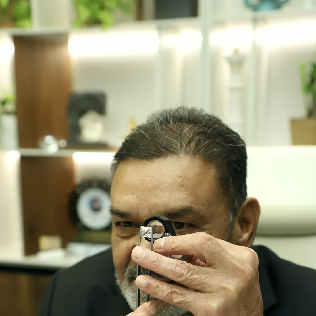 Senior grader examining a grown diamond